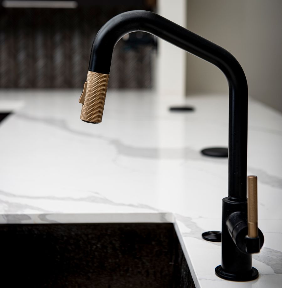 Charcoal and brass kitchen interior